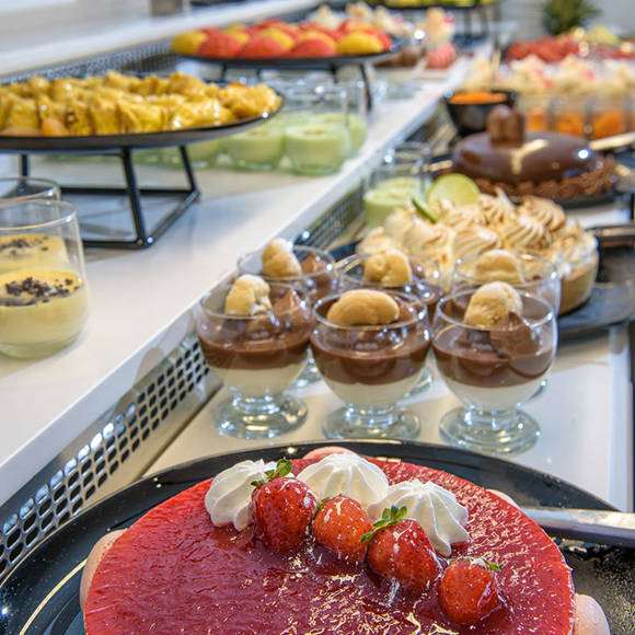 Buffet counter with appetizing sweets at the hotel restaurant
