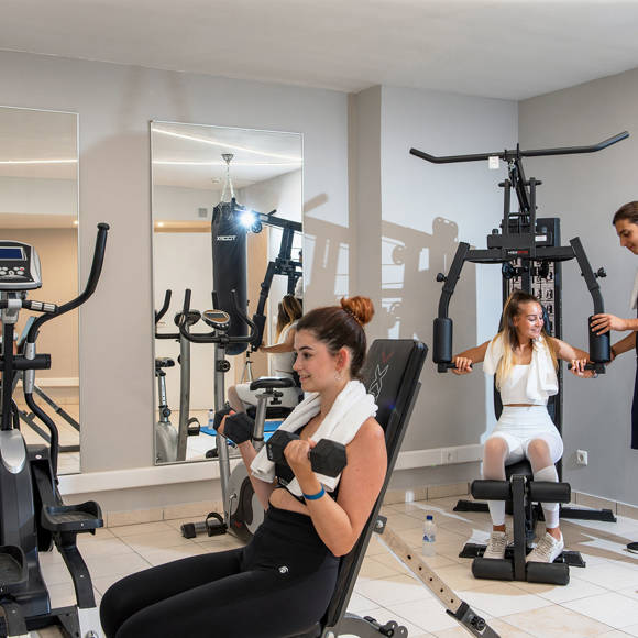 Guests working out in the Dore Hotel Gym using exercise machines