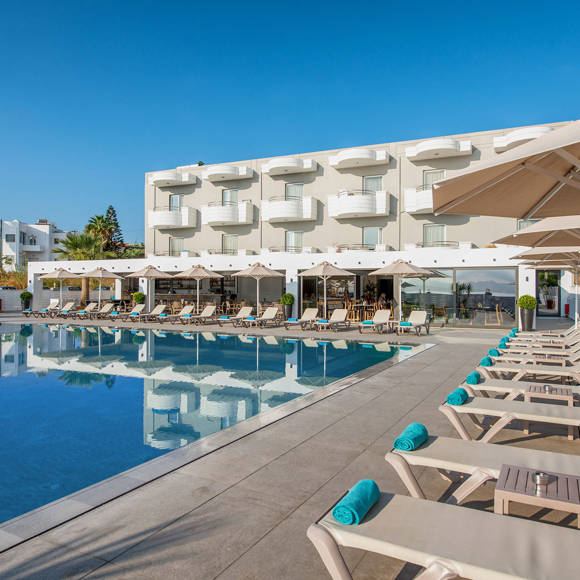 Dore Hotel outdoor pool area with sunbeds and umbrellas