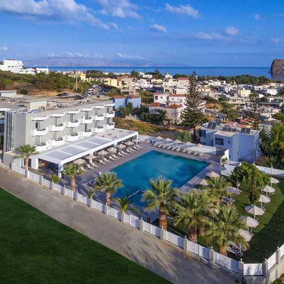 Aerial view of Dore Hotel near the beach with Thodorou Island in the background