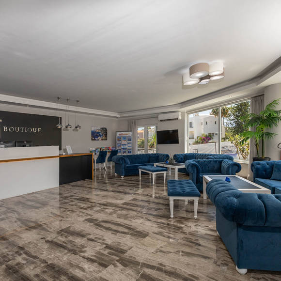 Dore Hotel modern reception area with marble flooring and cozy sitting lounges